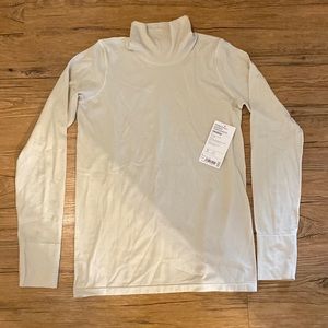 Brand new with tags Athleta Foresthill ascent turtleneck in Bone color